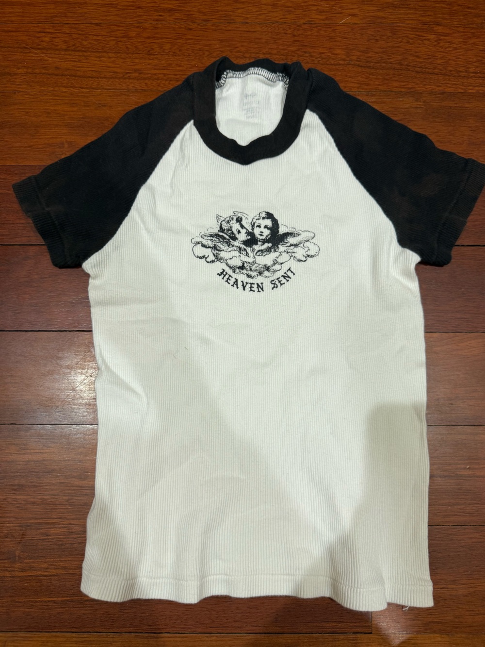 Brandy Melville White Tee with Black Raglan Sleeves and Cherub Graphic